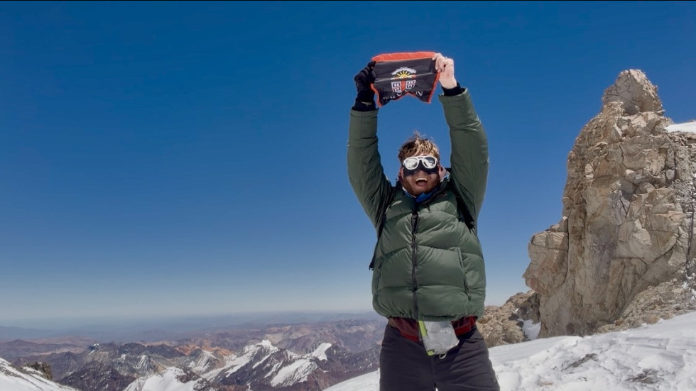 Mac Manning at the top of a mountain 