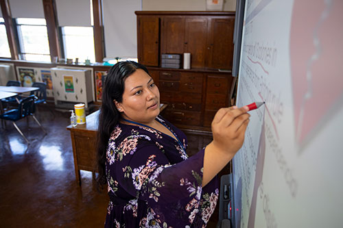 Carol working in a classroom